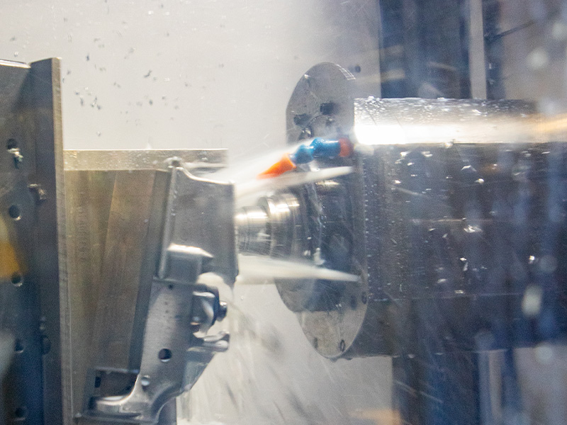 Coolant flowing over a component during CNC machining
